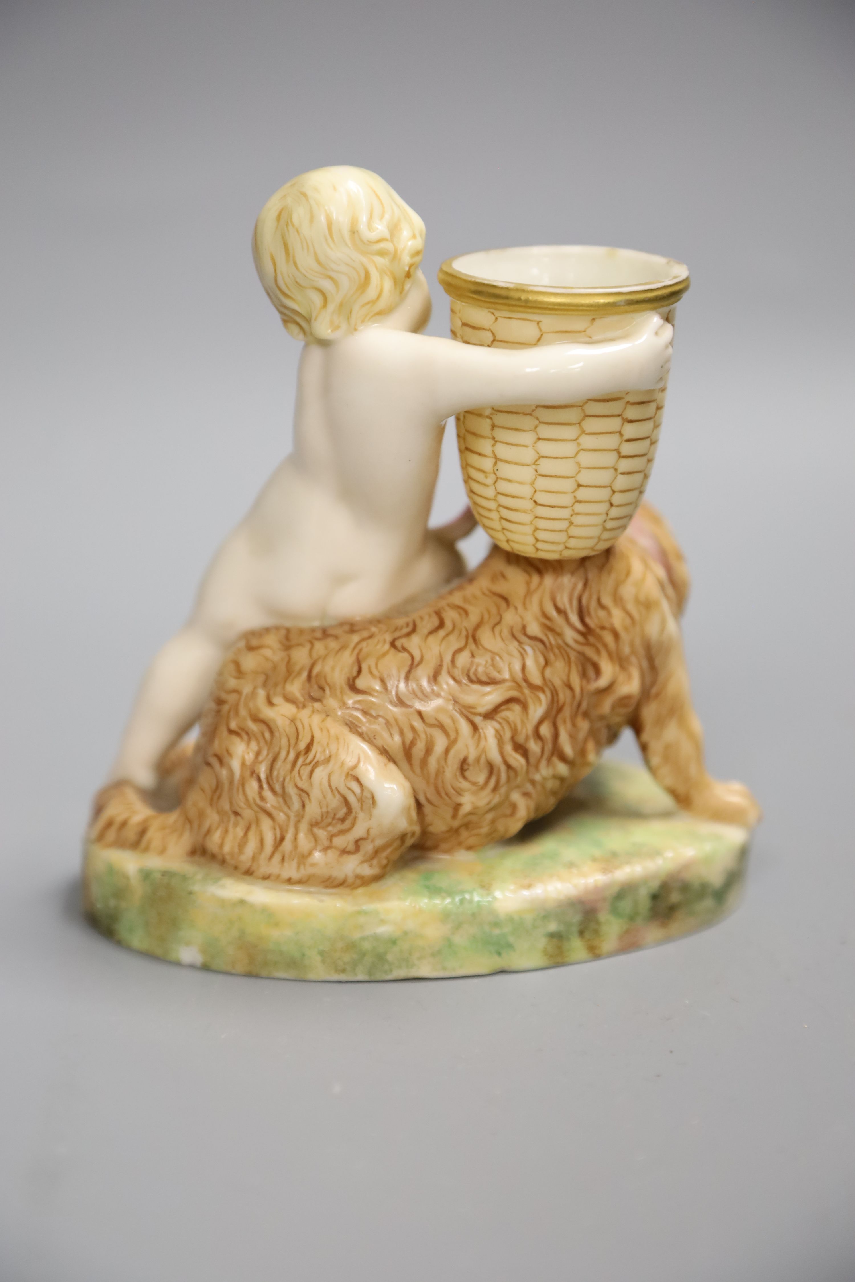 A Royal Worcester figure group of a child and dog, height 13cm